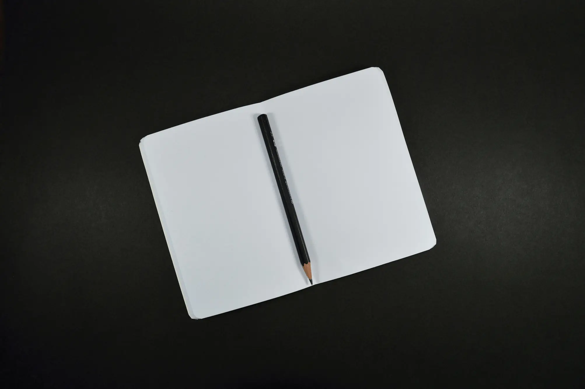 Empty Notebook and Pencil - Photo by Miguel Á. Padriñán: On Pexels